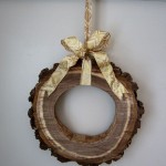 Naturally Sliced Wood Wreath Design with Small Shaped and Gold Ribbon Decor for Home Inspiration to Your House