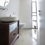 Amazing Bathroom Design of Beautiful Homely Atmosphere of Concrete House with Dark Brown Colored Wooden Drawer and White Colored Marble Floor