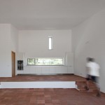 Appealing Interior of the JM Casa Odemira with Brown Stone Floor and Long White Kitchen Counter