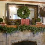 Appealing Natural Indoor Plants and Christmas Wreath Decorating Ideas on Stone Fireplace Rectangular Mirror in Wood Fence