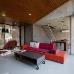 Appealing W House with Flashy Red Sofa Complementing Wood Coffee Table in Bright Living Room Glaring Arched Lamp