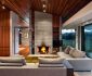 Astonishing Living Space Design of Pavilion Wairau House with Soft Grey Colored Concrete Chimney Wall and Dark Brown Wooden Ceiling
