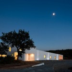 Attractive Lighting and White Wall of the JM Casa Odemira Exterior with Flat Roof and Glass Windows