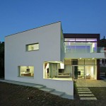 Awesome Building Design of J20 House with White Colored Outer Wall and Transparent Little Window which is Made from Glass Panel