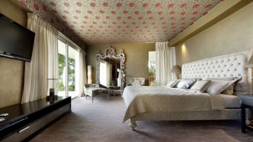 Awesome Luxury Resort Bedroom with Wide Bed and Wide Mirror under the Artistic Ceiling near Glas Walls