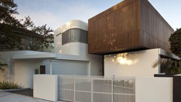 Breathtaking Front Yard Landscape Design of Contemporary House In Sydney with White Colored Wooden Fences and Dark Brown Upper Wooden Wall