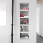 Breathtaking Room Space Design of Apartment Minimalist Andreja Bujevac with White Colored Wooden Shelf and Black Metallic Pillar