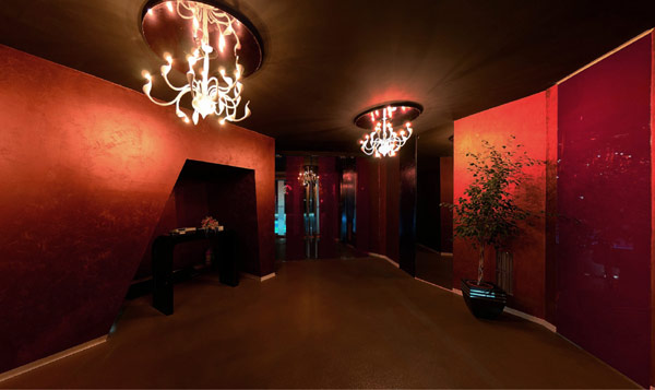 Bright Chandelier and Red Wall in the Sky Club Romania Alleyway with Brown Ceiling and Brown Floor