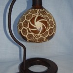 Brilliant Guardlamps Design Dark Brown Colored Stand which Has Spiral Wire Wrapped and Circle Shaped Feet which is Made from Wood