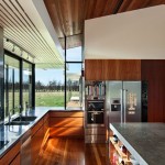 Brilliant Kitchen Design of Pavilion Wairau House with Light Grey Colored Kitchen Island and Light Brown Floor which is Made from Wooden Veneer
