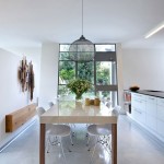 Captivating Dining Area Design of Beautiful Homely Atmosphere of Concrete House with White Colored Wooden Dining Table and Dark Pendant Lamp Cover