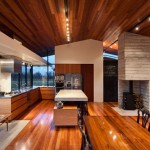 Captivating Kitchen Design of Pavilion Wairau House with Several Dark Brown Colored Wooden Chairs and Light Brown Wooden Dining Table