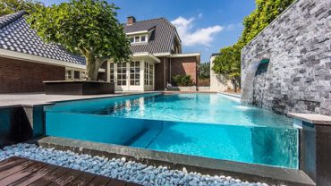 Charming Dream Backyard Aqua with Bright Infinity Pool and Stone Artificial Waterfall Peaceful Greenery on Minimalist Backyard