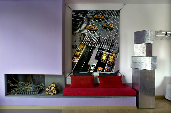 Colorful Details in the Smooth Interior with Red Lather and Open Fireplace under the Purple Wall