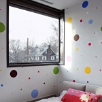Cool Bedroom Design of Bayside House with White Colored Concrete Wall which Has Several Colorful Dots and Red Colored Pillow