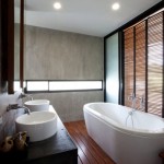 Cool W House Providing Stylish Bathroom with Rectangular Bathtub and Compact Washing Stand Shiny Ceiling Lights Stone Wall