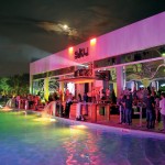 Cozy Pool Party in the Sky Club Romania with Wide Pool and Cozy Tables near Pink Light