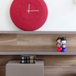 Cute Asian Figurines and Flashy Red Clock on Lacquered Wood Wall Shelves in Minimalist House  Interior