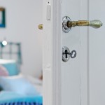 Excellent Apartment in Sweden Dominated by White Accent for Bright Visualization Antique Brass Knob on White Themed Door
