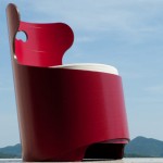 Expensive Red Outdoor Chair Made of Acrylic Decorated with Artistic Wing Back and Cushy White Pad