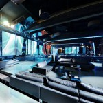 Fabulous Glass Balustrade and Grey Sofa Chaise inside the Sky Club Romania with Grey Concrete Floor