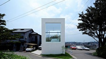 Fascinating Compact Japanese House Adopting Contemporary Architecture with Glass Window Geometric Grassy Front Yard Shady Ornamental Plants