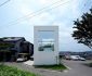 Fascinating Compact Japanese House Adopting Contemporary Architecture with Glass Window Geometric Grassy Front Yard Shady Ornamental Plants