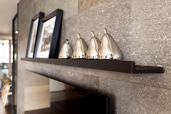 Fascinating Decor Details inside the Breezy Apartment with Grey Stone Wall and Wooden Shelf on it