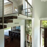 Fascinating Mandeville Residence with Steep Wood Floating Staircase Stylish Barstools Facing Granite Countertop Sleek Wood Floor