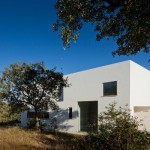 Fascinating View of the White Wall and Wide Glass Windows in the JM Casa Odemira Exterior