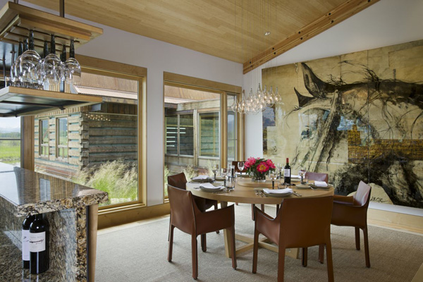 Gorgeous Lake House with Exotic Wall Art behind Modern Dining Set under Glaring Chandelier Marble Kitchen Island