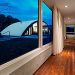 Modern Arc House Maziar Behrooz Indoor Entryway with Sleek Wooden Floor and Glass Windows and Curtain