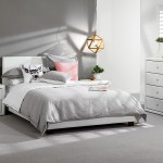 Attractive Snooze Bedroom Suites Interior with White Bed and Grey Duvet between White Nightstands