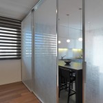 Awesome Blurred Glass for Modern Sliding Door Design beside Stylish Kitchen with Dark Stools and Bar Counter