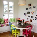 Colorful Chairs around Round Teak Table in Small Dining Area with Retro Interior Design Ideas
