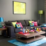 Colorful Cushions on Grey Sofa in Sitting Area using Bright Living Room Color Ideas with Grey Wall