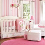 Comfortable Baby Girls Rooms with White Armsofa and Ottoman beside White Crib and Pink Blanket