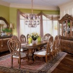 Gorgeous Carving on Antique Dining Room Furniture made of Wood under Stunning Grey Chandelier