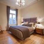 Gorgeous Ceiling Lamp above Grey Bed and Bedding between Brown Nightstands in Snooze Bedroom Suites