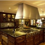 Gorgeous Wooden Cabinets facing Glossy Range Hood above Wide Oak Island for Brilliant Tuscan Kitchen Design Ideas