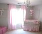 Lovely Baby Girls Rooms with White Crib and Pink Tufted Bench near Sheer Pink Curtain