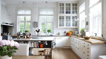 Marvelous White Wall Cabinets above Long Counter and Oak Countertop inside Swedish Kitchen Design Ideas