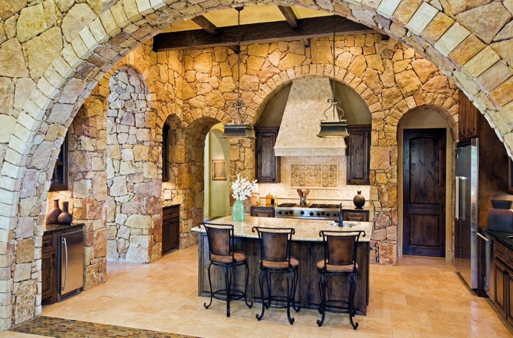 Mesmerizing Kitchen using Farmhouse Style Furniture with Oak Island and Metal Stools near Stone Wall