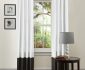 Minimalist White Framed Window and Black and White Curtains near Round Side Table and Modern Table Lamp