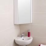Modern White Sink under Mirrored Corner Bathroom Cabinet on Grey Tile Wall inside Small Bathroom