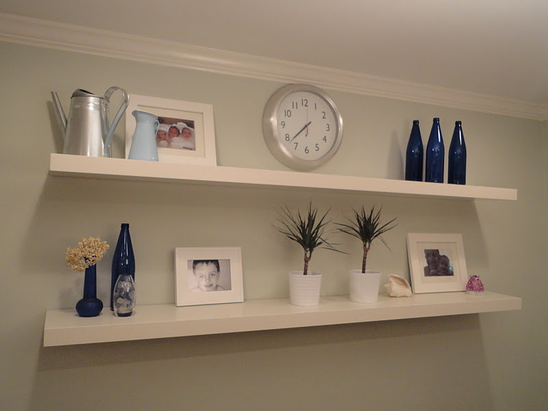 Simple White Panel for Appealing Floating Shelves IKEA with Various Ornaments on Grey Painted Wall