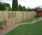 Simple Wooden Garden Fences Ideas with Interesting Detail beside Brick Pathway on Green Grass Yard