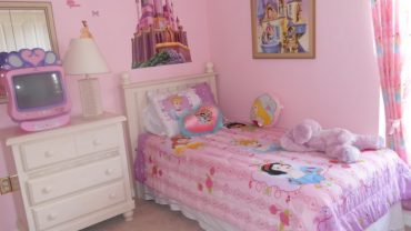 Small Pink Bedroom Ideas for Girls with White Dresser and Single Bed beside Pink Painted Wall