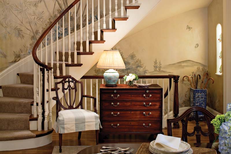 Traditional House Interior with Oak Cabinet and Antique Wooden Chair Designs near Curve Staircase