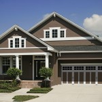 Wide Garage Door in Spacious House with Brown Exterior House Paint Ideas and White Pillars